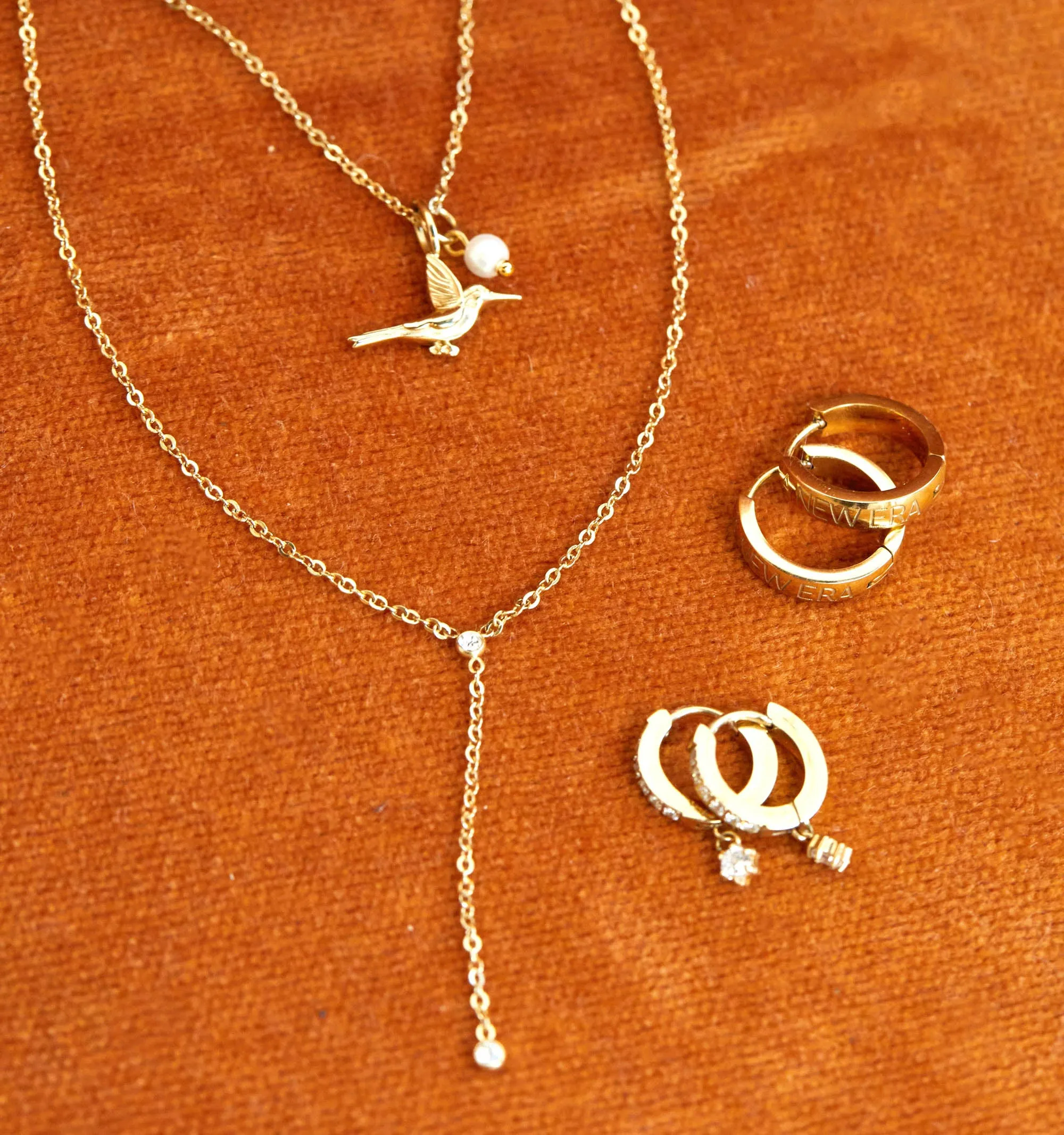 To effectively optimize the e-commerce product title for searchability and appeal, we can include key details and modifiers that describe the item accurately. Here is a revised version:

Kaeli Mae x RELLERY Elegant Gold-Plated Necklace with Unique Pendant Design

This title includes the brand collaboration, a descriptive adjective (elegant), the material (gold-plated), the product type (necklace), and a feature (unique pendant design).